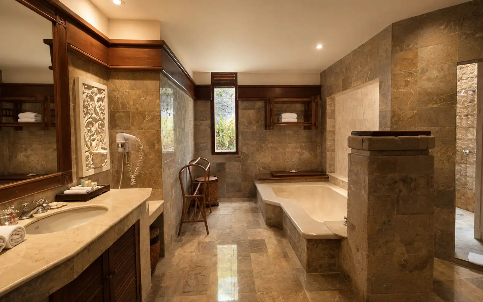 Oversized Garden Suite bathroom with bathtub at Grand Balisani Suites Bali